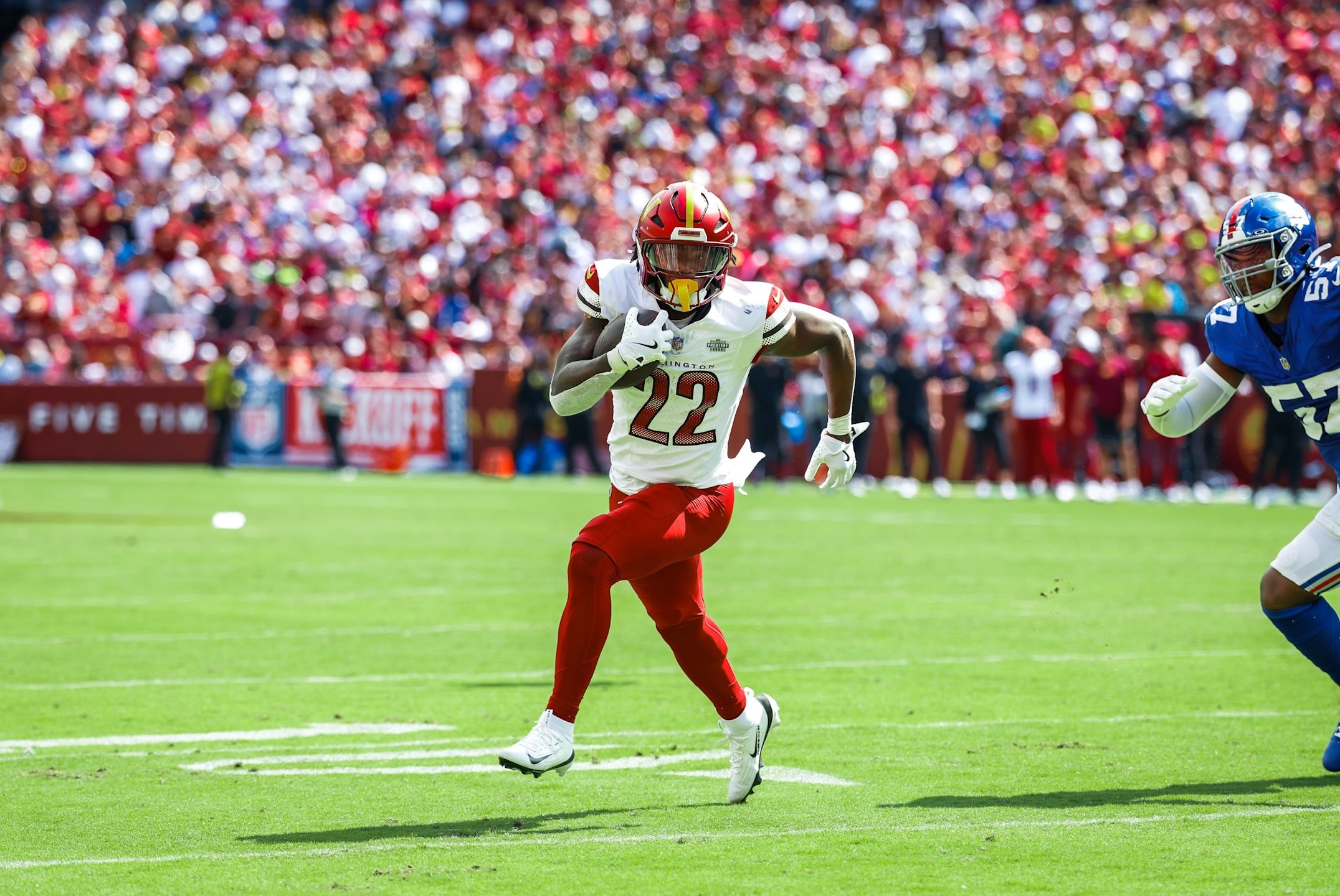Commanders running back Bill Croskey-Merritt runs around the edge against the Giants in his NFL debut