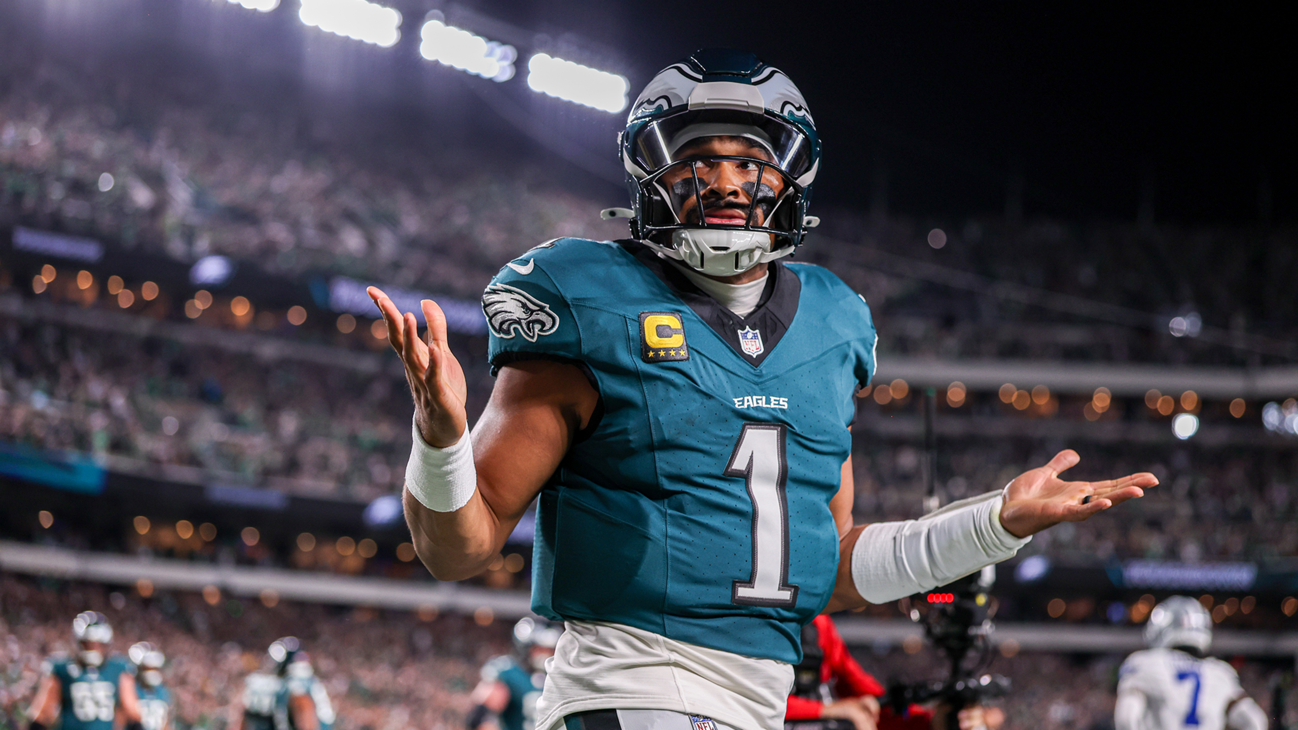 Eagles quarterback Jalen Hurts celebrates with a shrug after scoring a touchdown versus the Cowboys.
