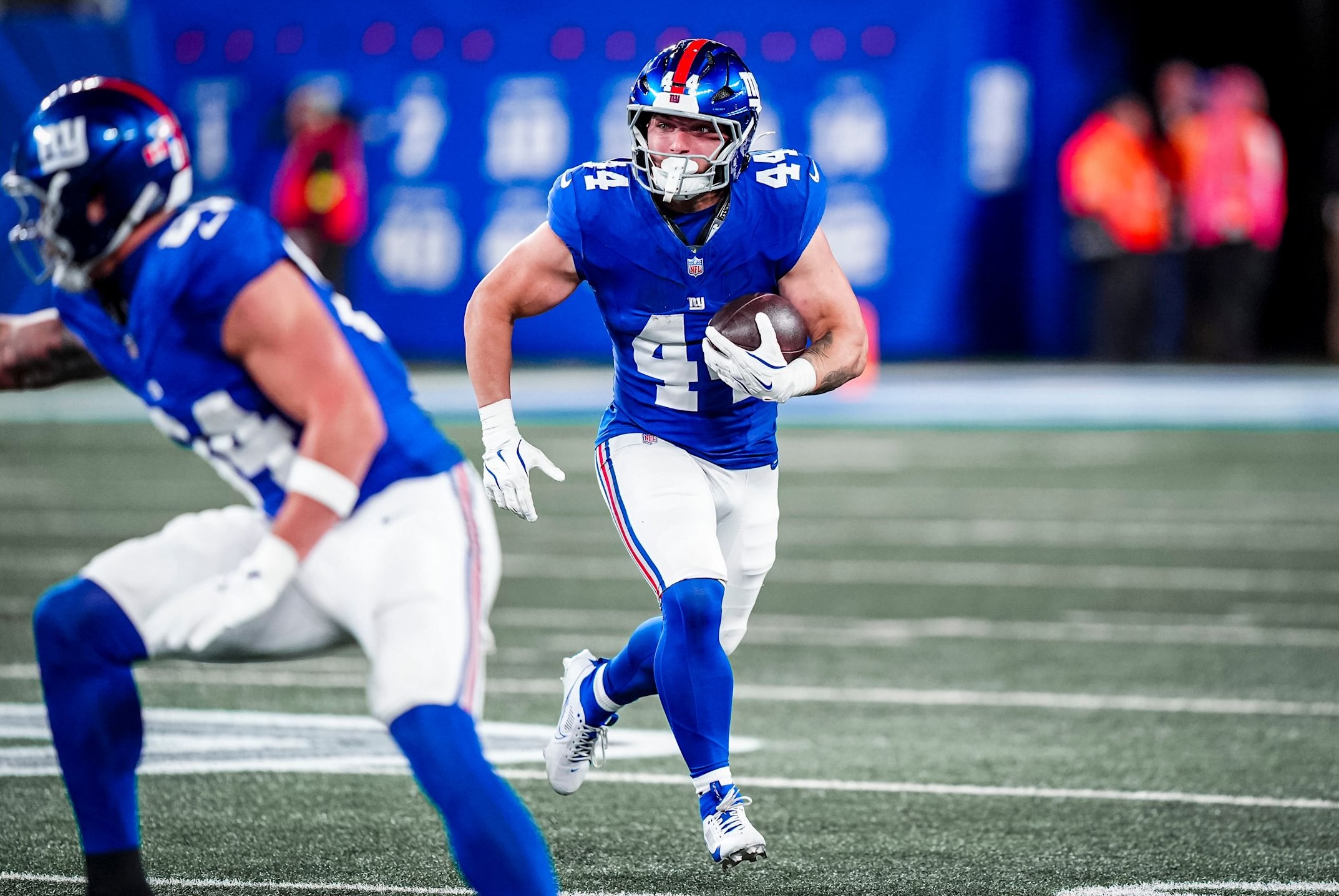 Giants rookie running back Cam Skattebo runs with the ball in a three-touchdown performance as New York defeated Philadelphia in a Week 6 game in the 2025 NFL season.