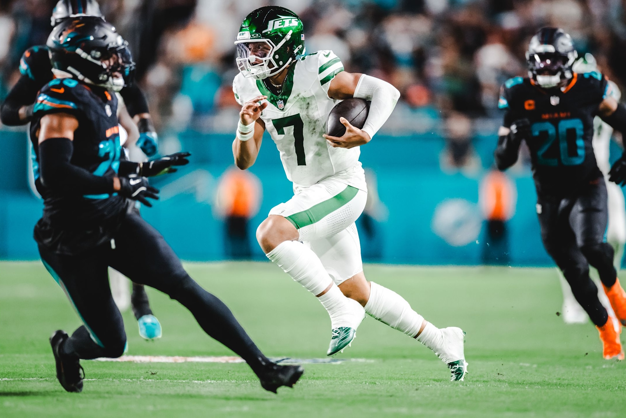 Jets quarterback Justin Fields weaves through the defense in a 27-21 loss to the Miami Dolphins on Monday Night Football in Week 4 of the 2025 NFL season.