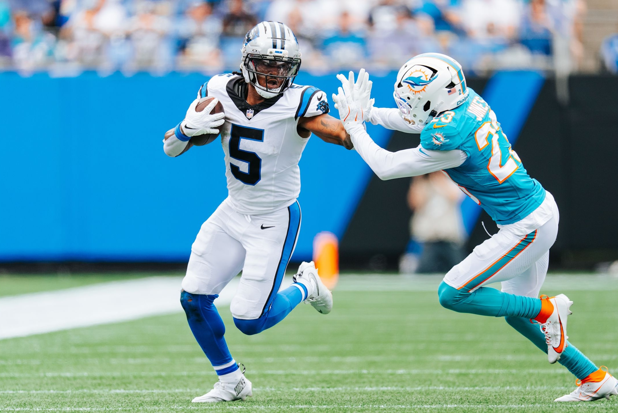 Panthers running back Rico Dowdle stiff arms a defender on his way to a career day in a 27-24 win over the Dolphins in Week 5 of the 2025 NFL season.