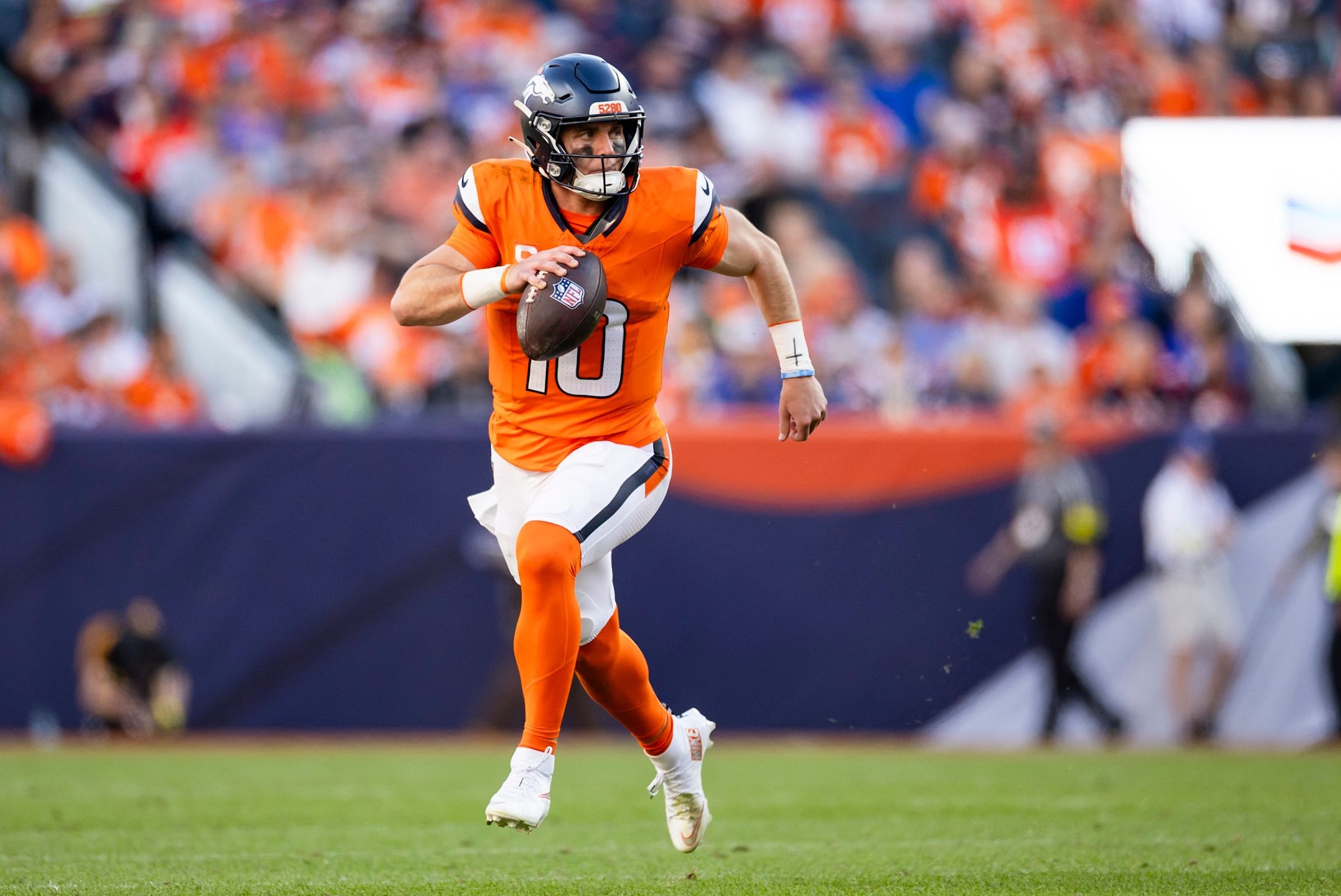 Broncos quarterback Bo Nix scrambles in a comeback win over the Giants in Week 7 of the 2025 NFL season.