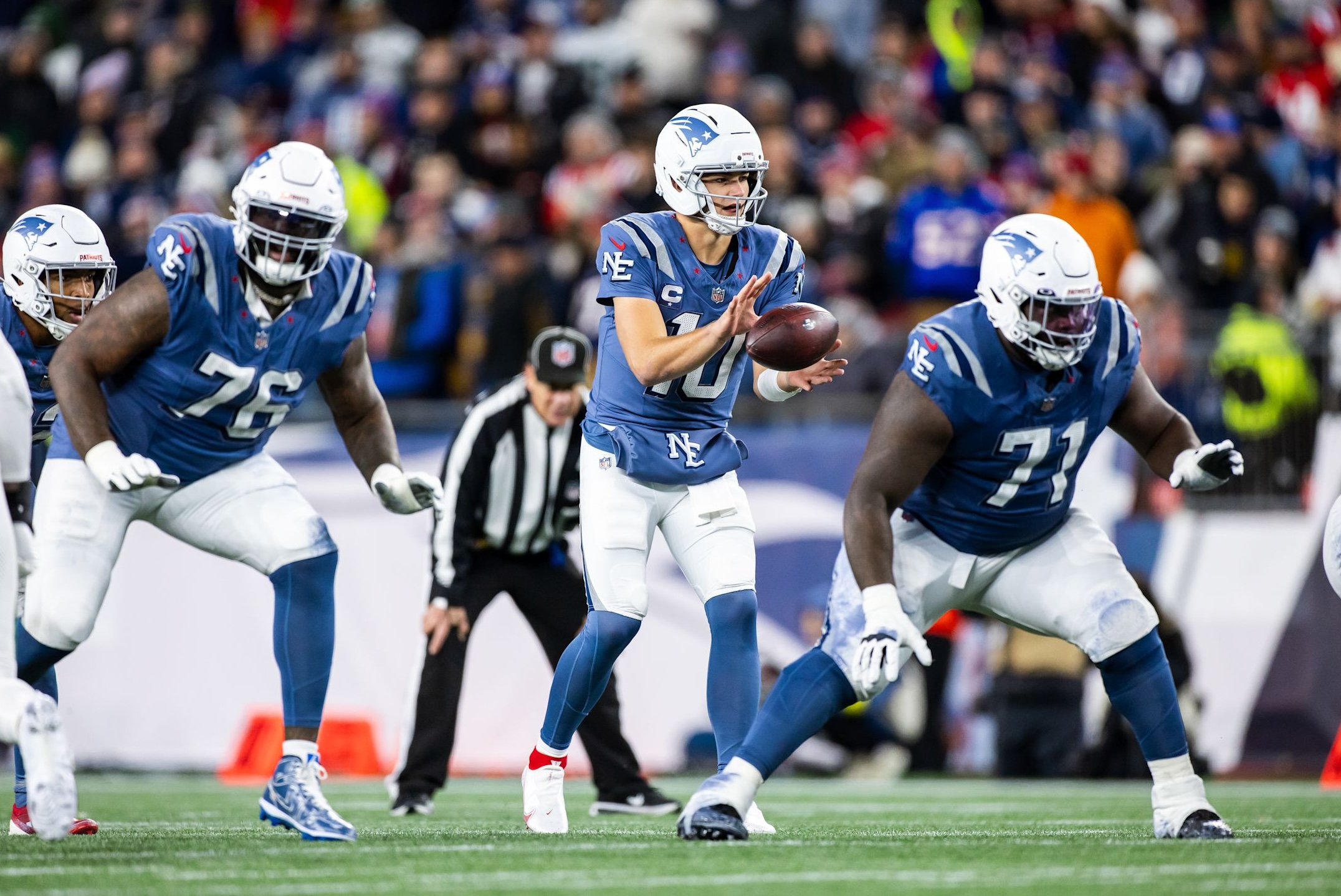 Patriots quarterback Drake Maye takes a snap in a 27-14 win over the Jets in Week 11 of the 2025 NFL season.