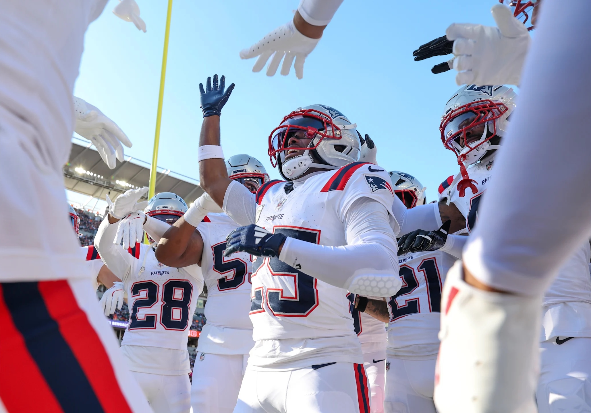 New England Patriots cornerback Marcus Jones and teammates during a 2025 win against the Cincinnati Bengals.