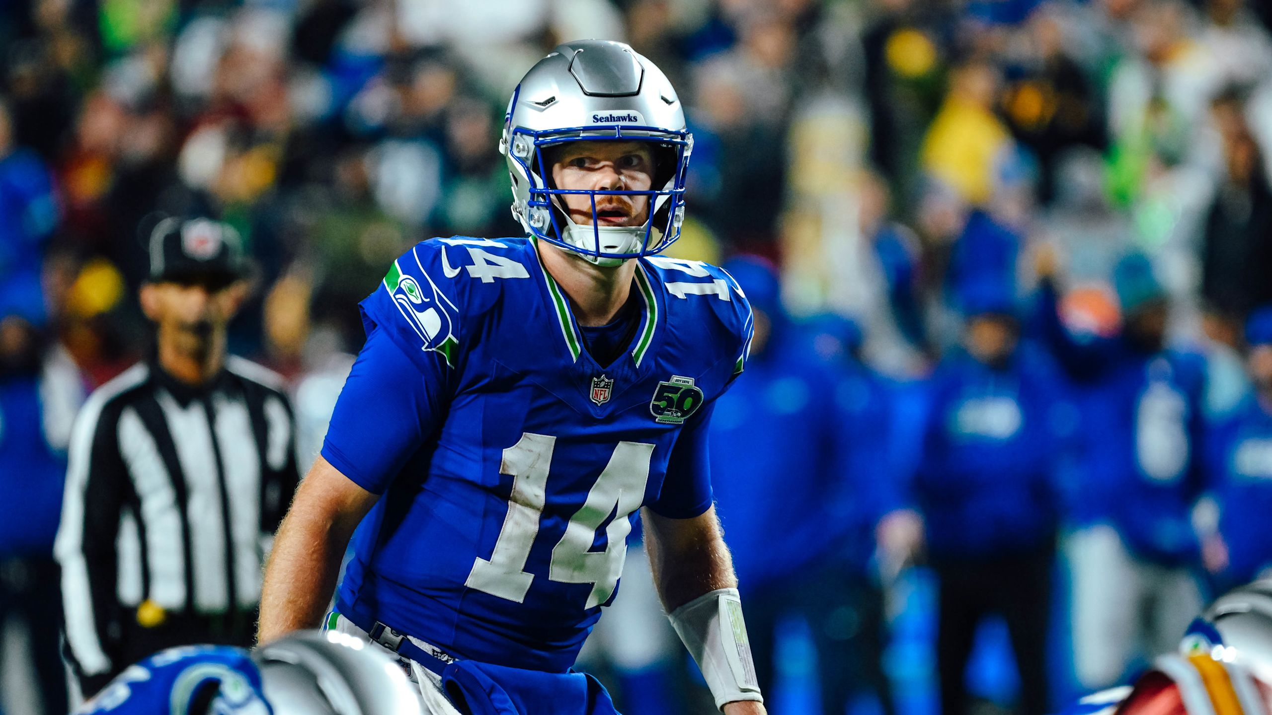 Seahawks quarterback Sam Darnold scans the defense in a 38-14 win over the Commanders in Week 9 of the 2025 NFL season.