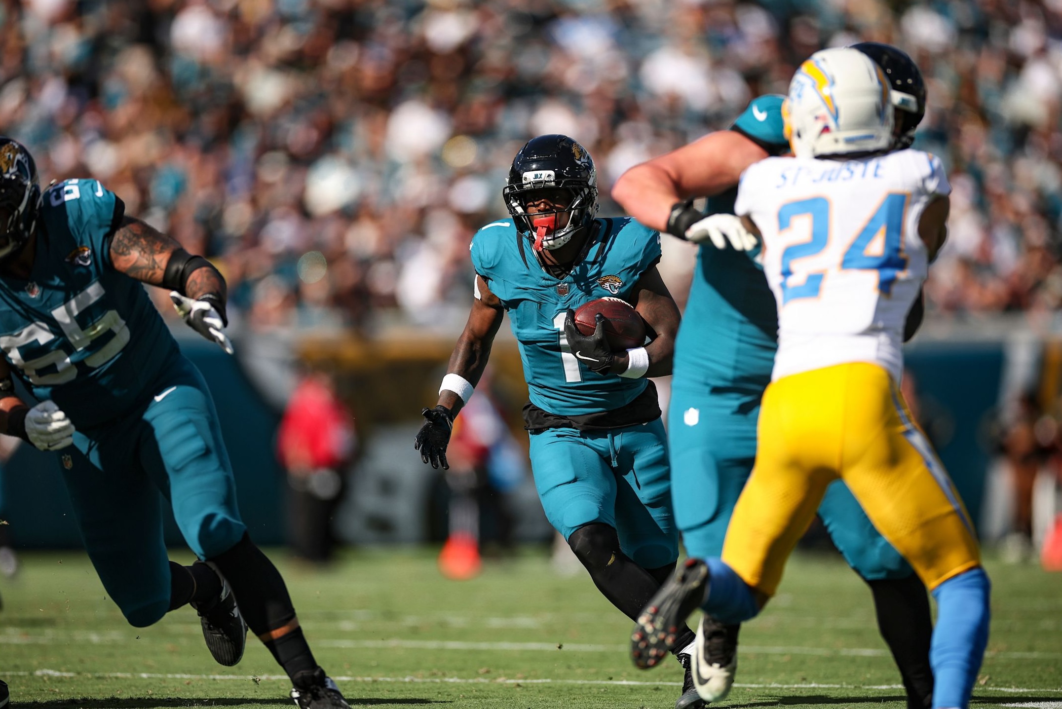 Jaguars running back Travis Etienne Jr. runs the ball in a two-touchdown performance as Jacksonville beat the Chargers in Week 11 of the 2025 NFL season.