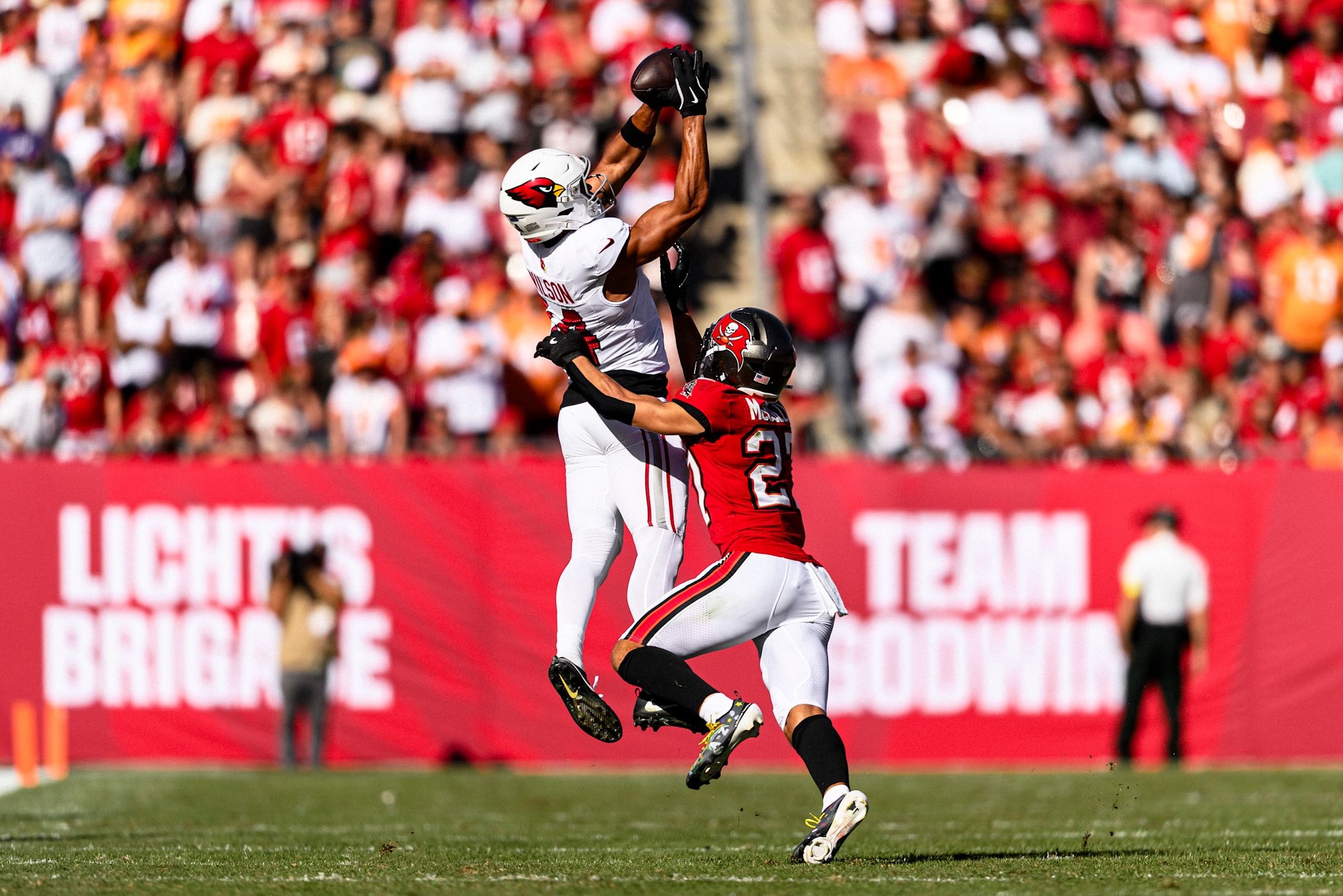 Cardinals wide receiver Michael Wilson leaps for a catch in tight coverage as Arizona lost to the Buccaneers, 20-17, in Week 13 of the 2025 NFL season.