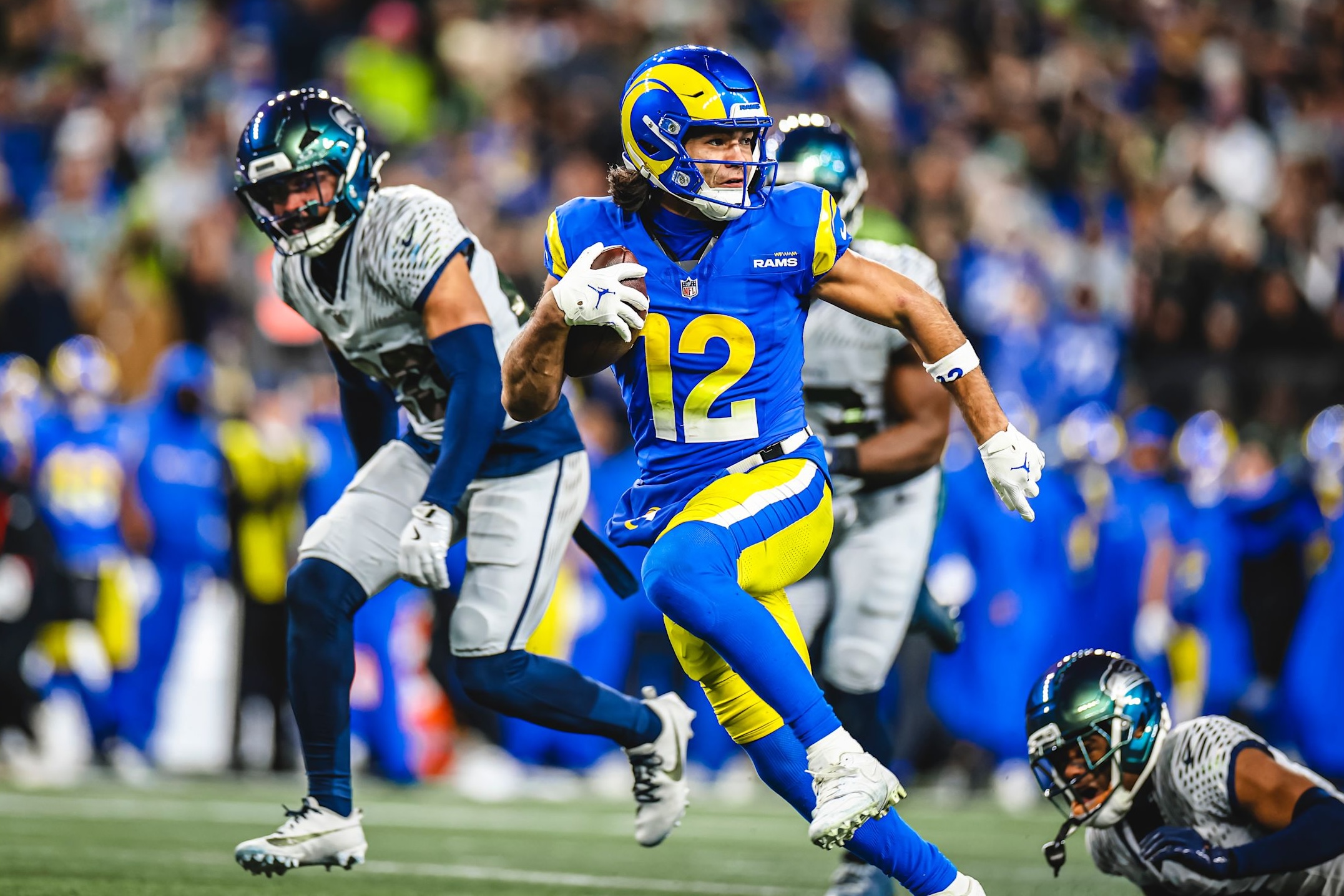 Rams wide receiver Puka Nacua breaks free in the open field of a monster performance in a 38-37 loss to the Seahawks in Week 16 of the 2025 NFL season.