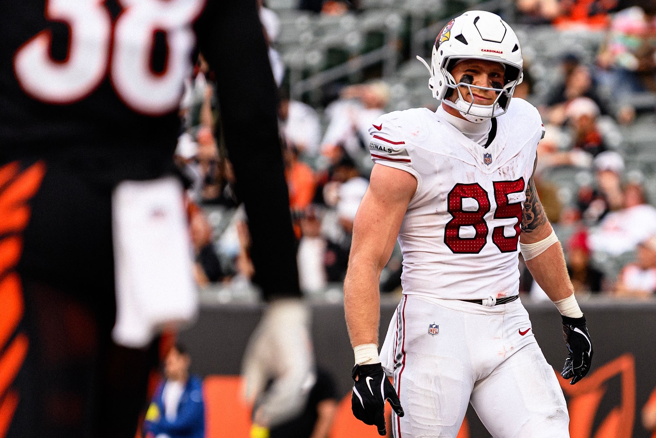 Cardinals tight end Trey McBride smirks at a defender as Arizona lost to the Bengals, 37-14, in Week 17 of the 2025 NFL season.