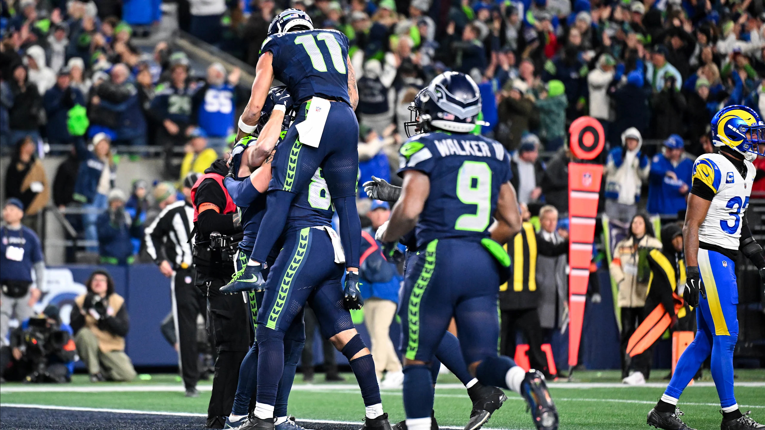 Seattle Seahawks wide receiver Cooper Kupp celebrates with teammates after a touchdown against the Los Angeles Rams in the NFC Championship Game.
