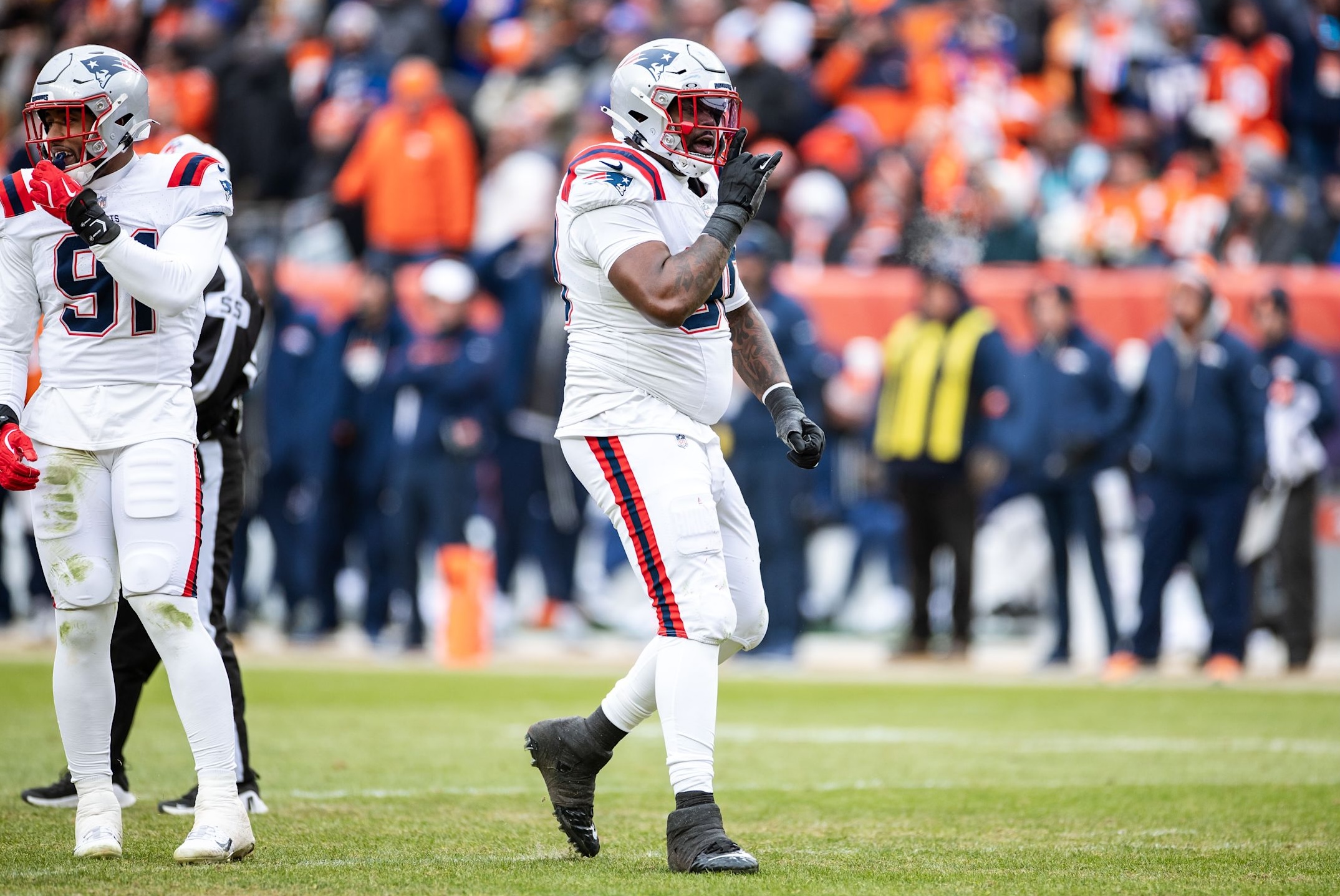 Patriots defensive lineman Christian Barmore silences the crowd in the AFC Championship Game win over the Broncos during the 2025 NFL postseason.