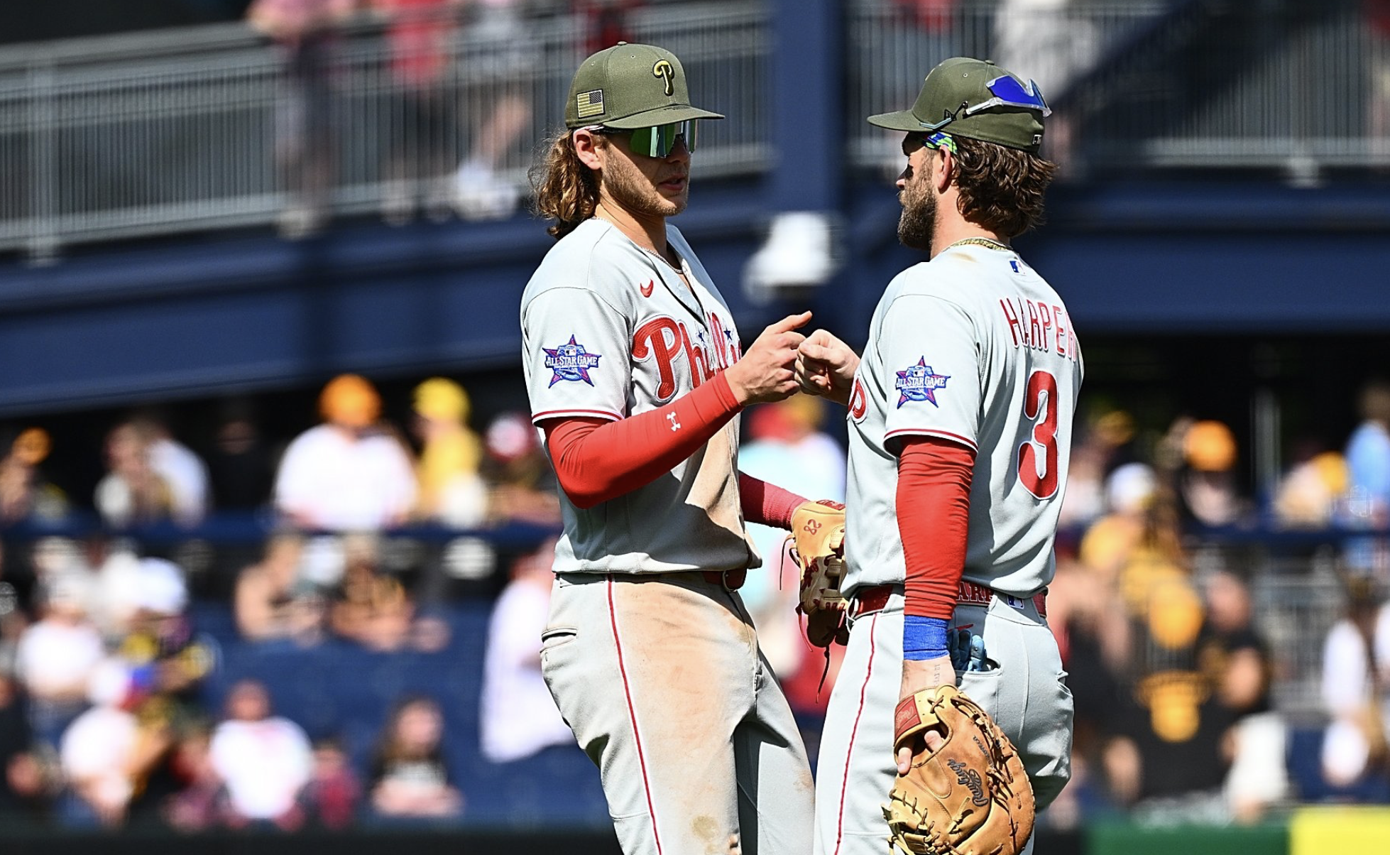Phillies teammates Alec Bohm and Bryce Harper celebrating following a win over the Pirates during the 2026 MLB season.