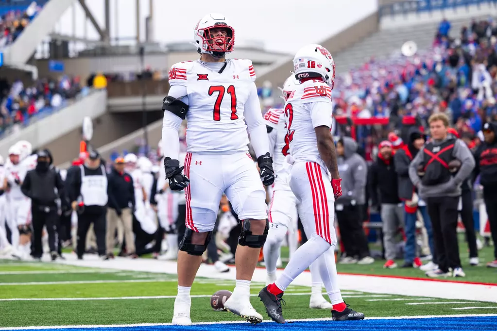 Utah offensive tackle Caleb Lomu celebrates during the 2025 college football season.