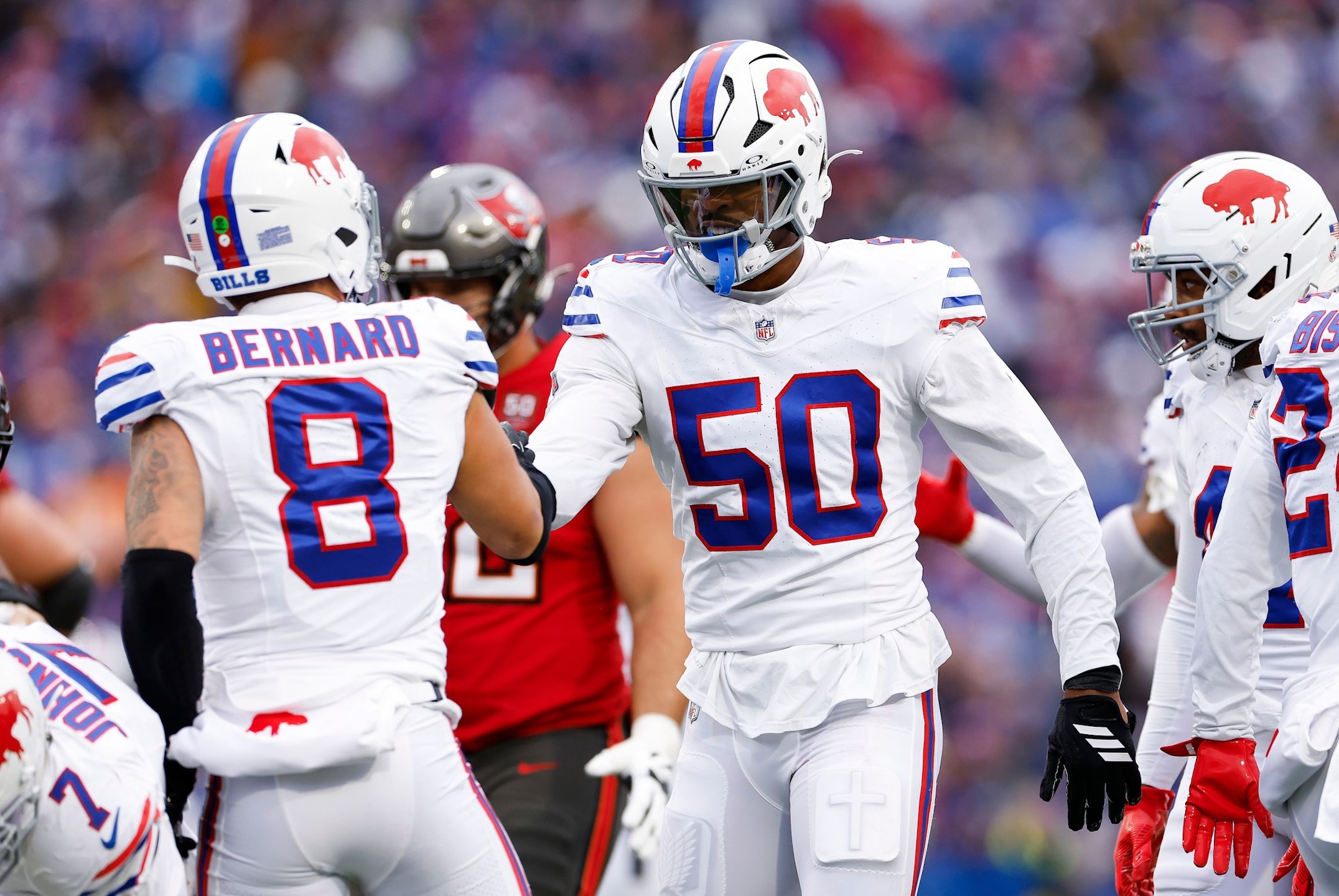 Bills defenders Greg Rousseau and Terrel Bernard celebrate during a win over the Buccaneers in the 2025 NFL season.